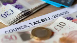 A close-up of a UK council tax bill for 2024/25, with twenty-pound notes and coins. A representation of financial planning, tax reductions, and support schemes for carers and elderly parents.