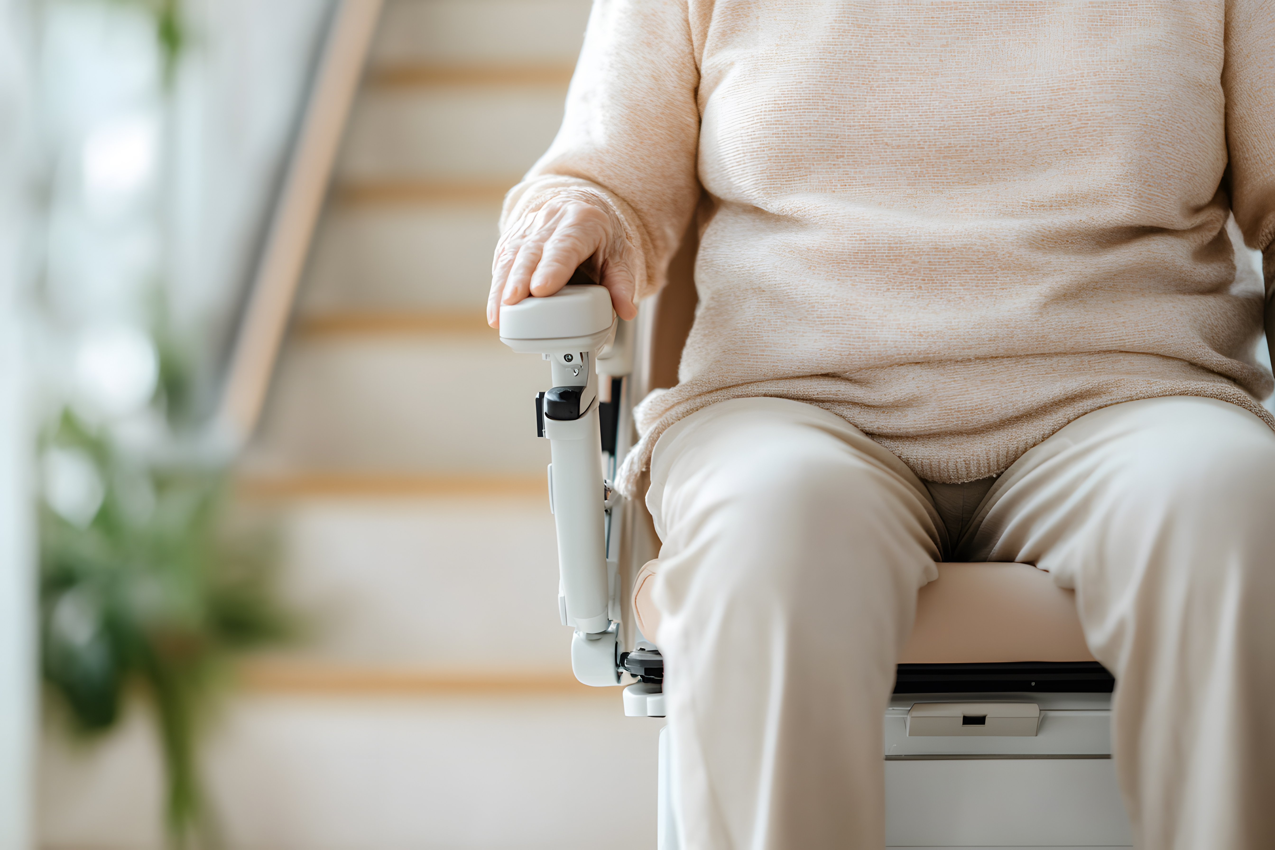 Elderly person on a stairlift. A home modification option for your elderly parent.