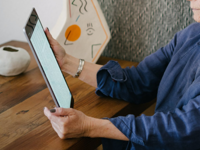 Older woman holding a tablet device
