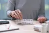 A carent sorting medicine for their elderly parent