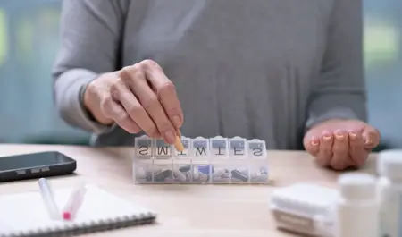 A carent sorting medicine for their elderly parent