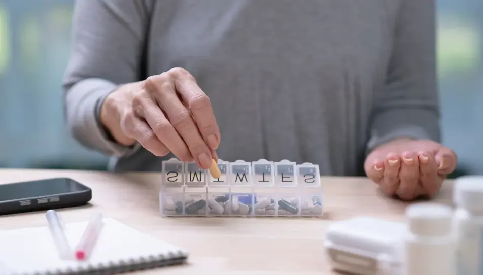 A carent sorting medicine for their elderly parent