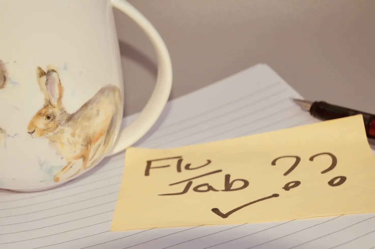 Post it note reminder to get a flu jab