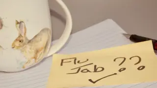 Post it note reminder to get a flu jab