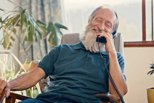 Elderly parent using their landline phone still during the digital switchover