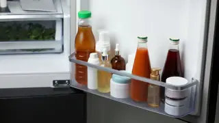 Bottles in a fridge door. Represents the 'Message in a Bottle' scheme by Lion’s Club International, where a bottle in a fridge has personal and medical information in a place where it can easily be found in case your elderly parent has an emergency.