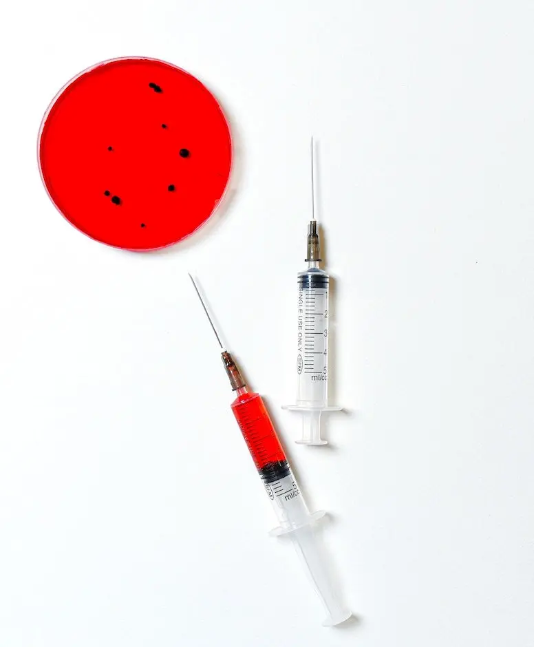 Image of a virus in a petri dish with two syringes lying next to it