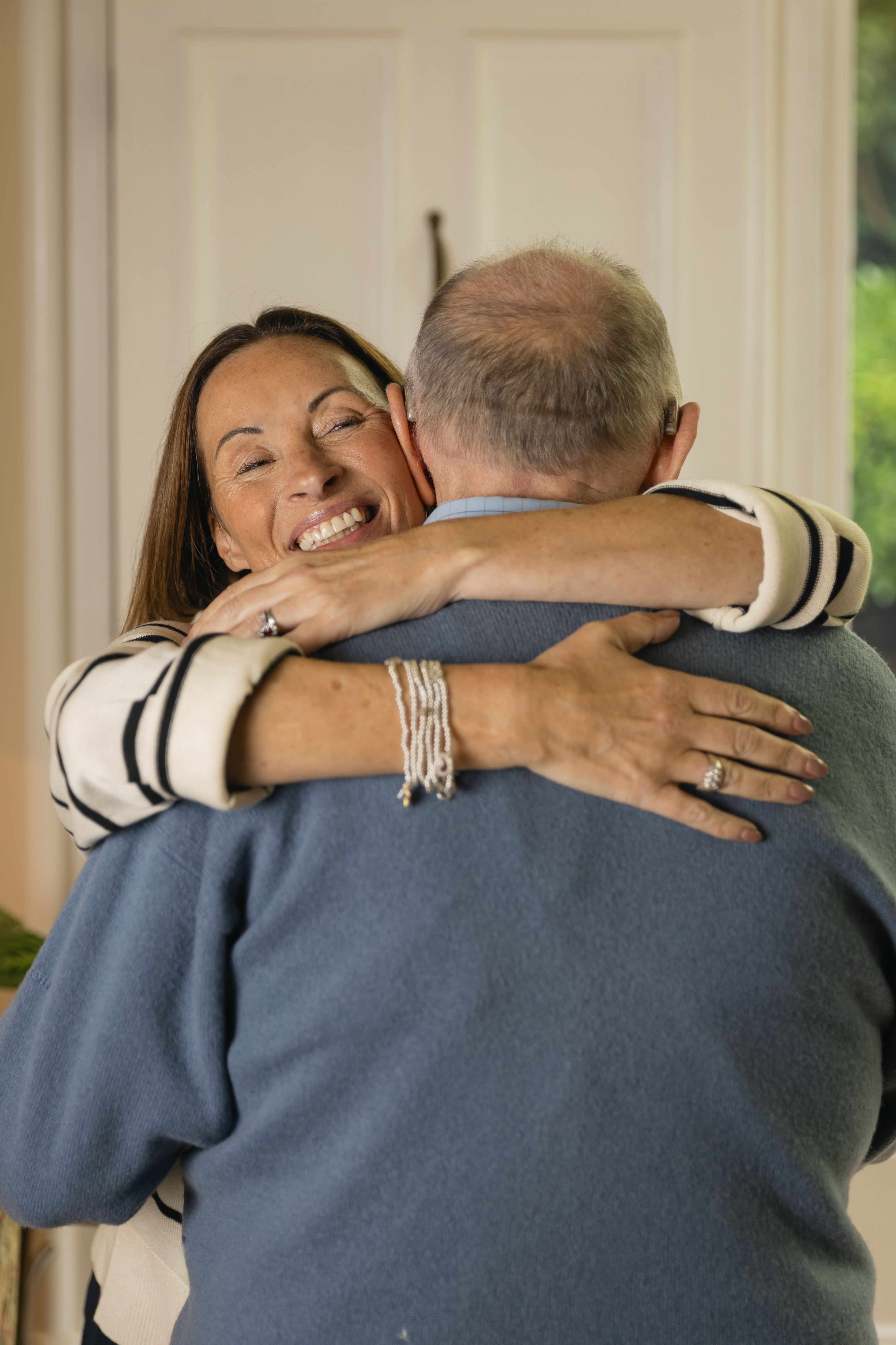 Image of a woman caring for her elderly parent - a carent